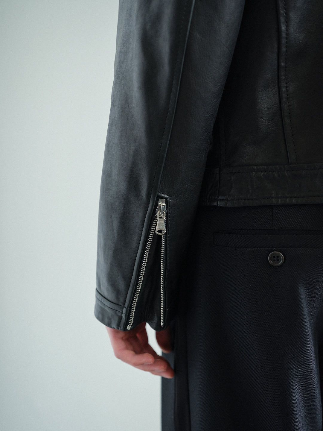 CURVED-ZIP NAPPA LEATHER JACKET in black
